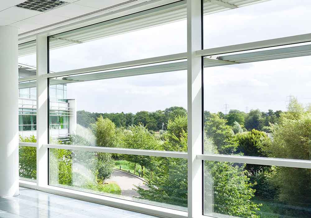smart workplaces - healthy buildings - natural light from a window looking towards a green space